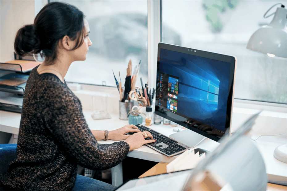 WePurpose Technology - Managed IT Support for Charities - Scotland - Woman working at a PC